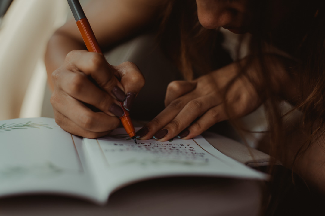 Overland elopement Japan - Bride writing her vows