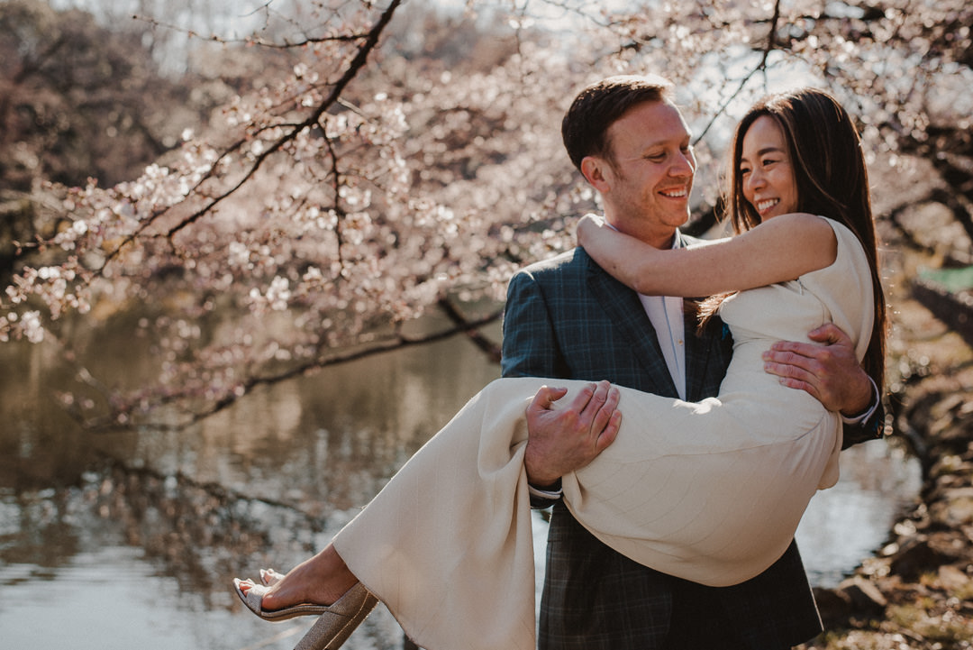 Couple in love, groom holds his newly wed bride.