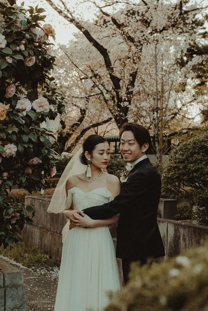 Cherry blossoms and roses with engagement couple

