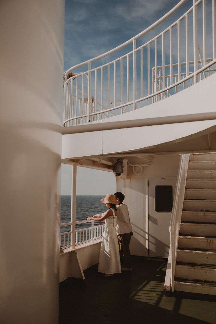 Candid shot of a couple on the ferry during island elopement
