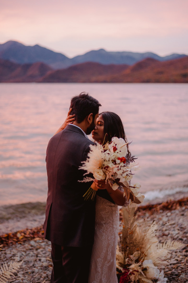 Bride kisses the groom after the wedding ceremony on their fall elopement in Japan