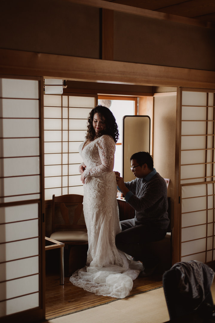Nagano Ryokan Elopement - Helping her with the dress