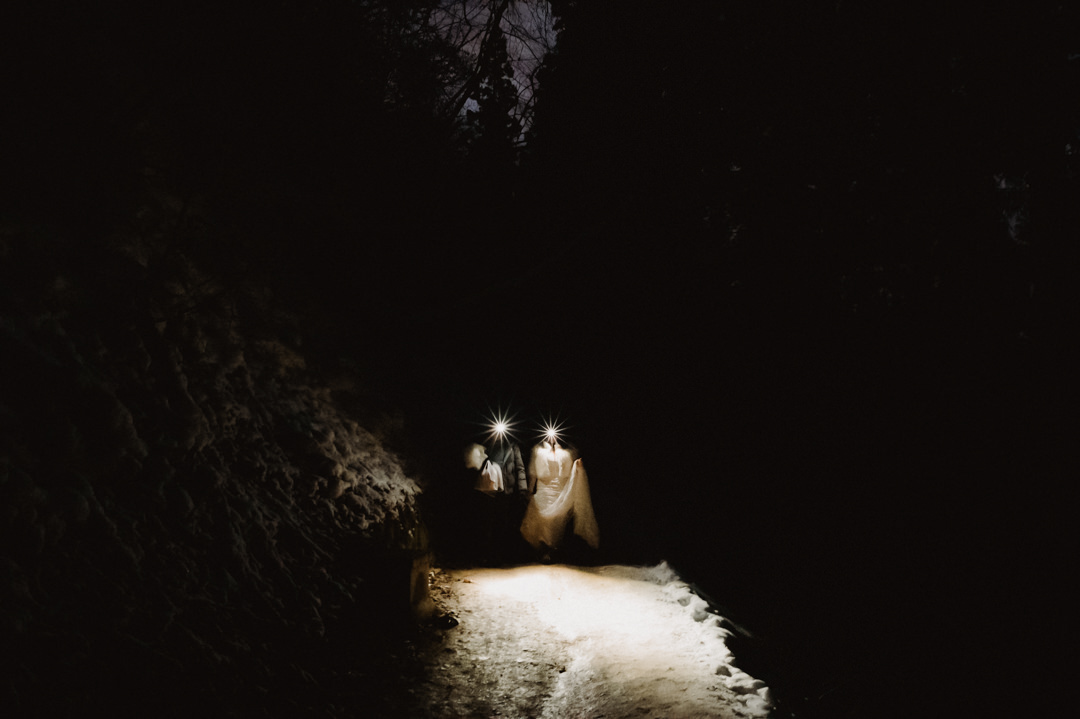 Nagano Ryokan Elopement -  Couple walking in the dark with headlamps