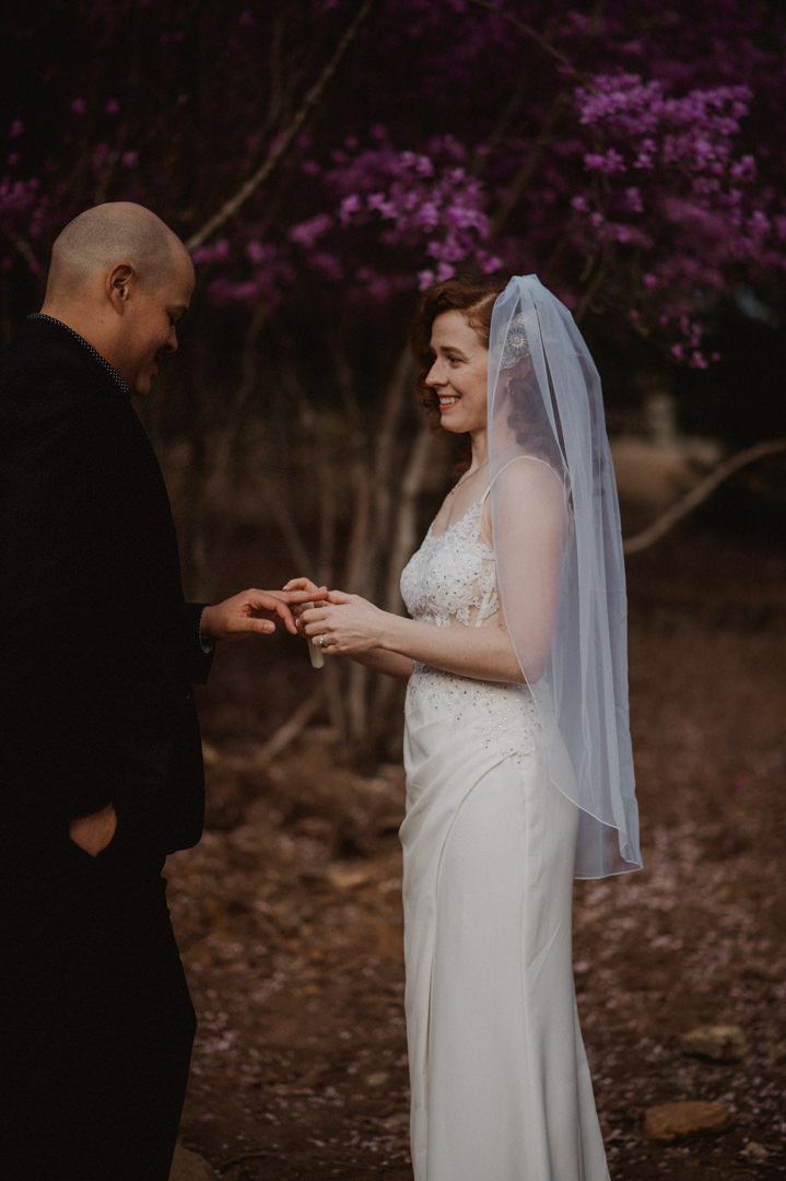 Arashiyama Bamboo Forest Elopement - Putting on the ring during elopement wedding ceremony