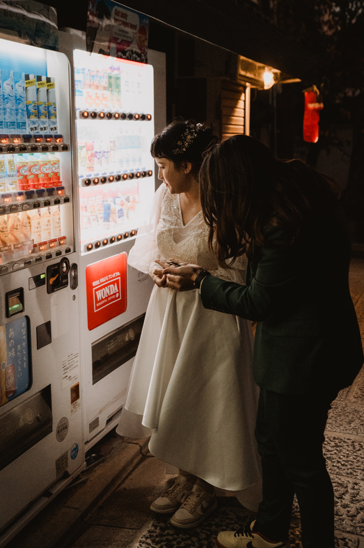 LGBTQ+ Elopement - buying drink from vending machine 