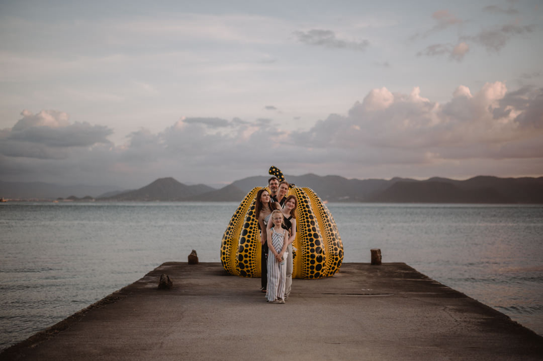 Family Elopement in Japan - family photo in front of Yellow Pumpkin in Naoshima  
