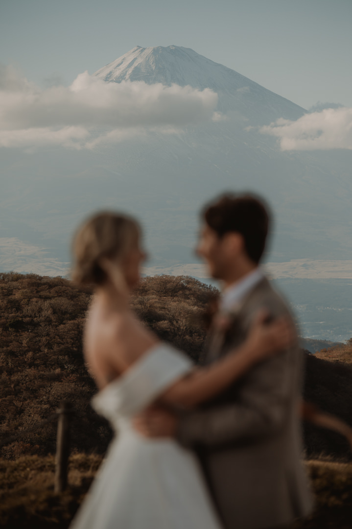 Hakone Elopement - couple is holding each other with Mt. Fuji backdrop