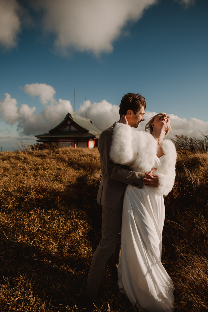 Hakone Elopement - couple is laughing in front of shrine 