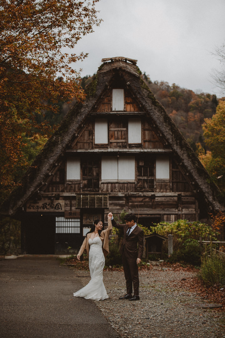 Japan Roadtrip Elopement - dancing in front of thatched roof house
