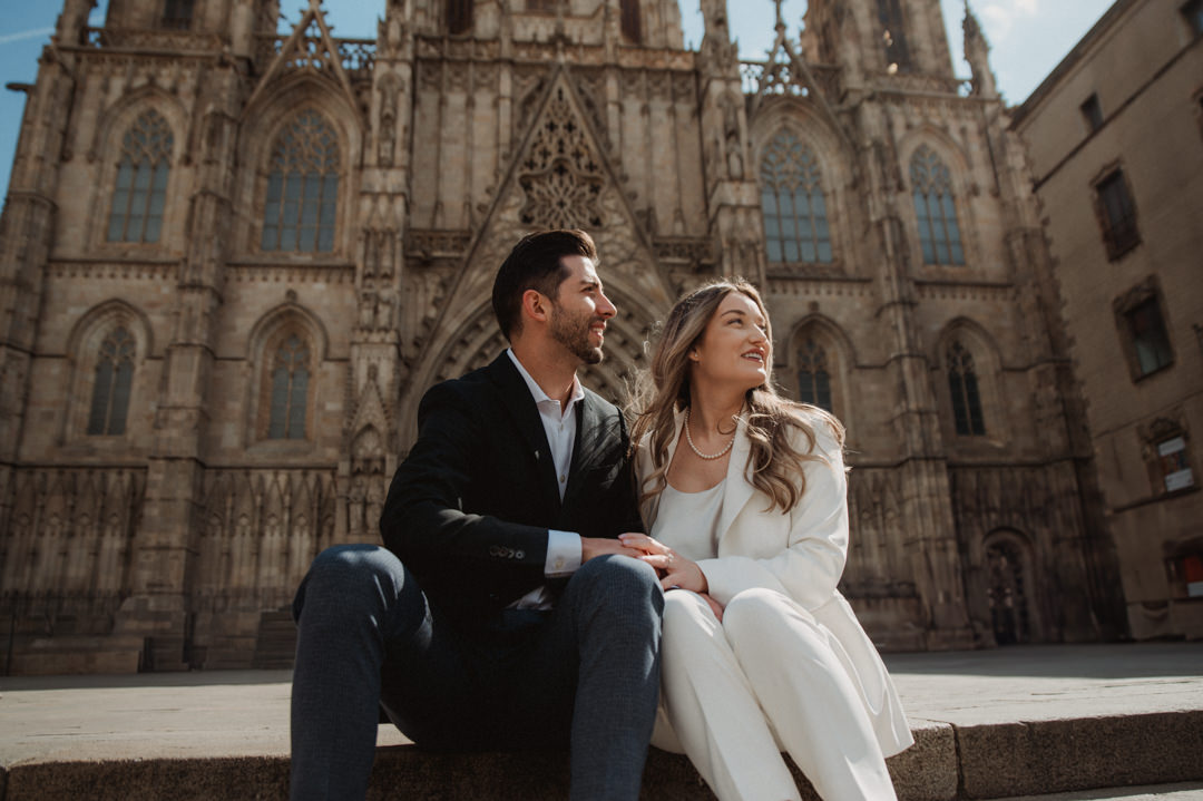 marimurtra elopement - couple holding each other in front of church