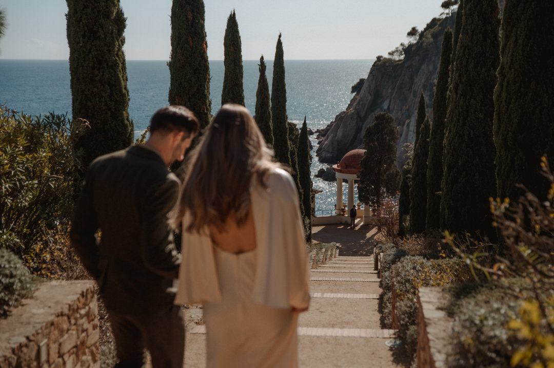 marimurtra elopement - walking toward their wedding venue 