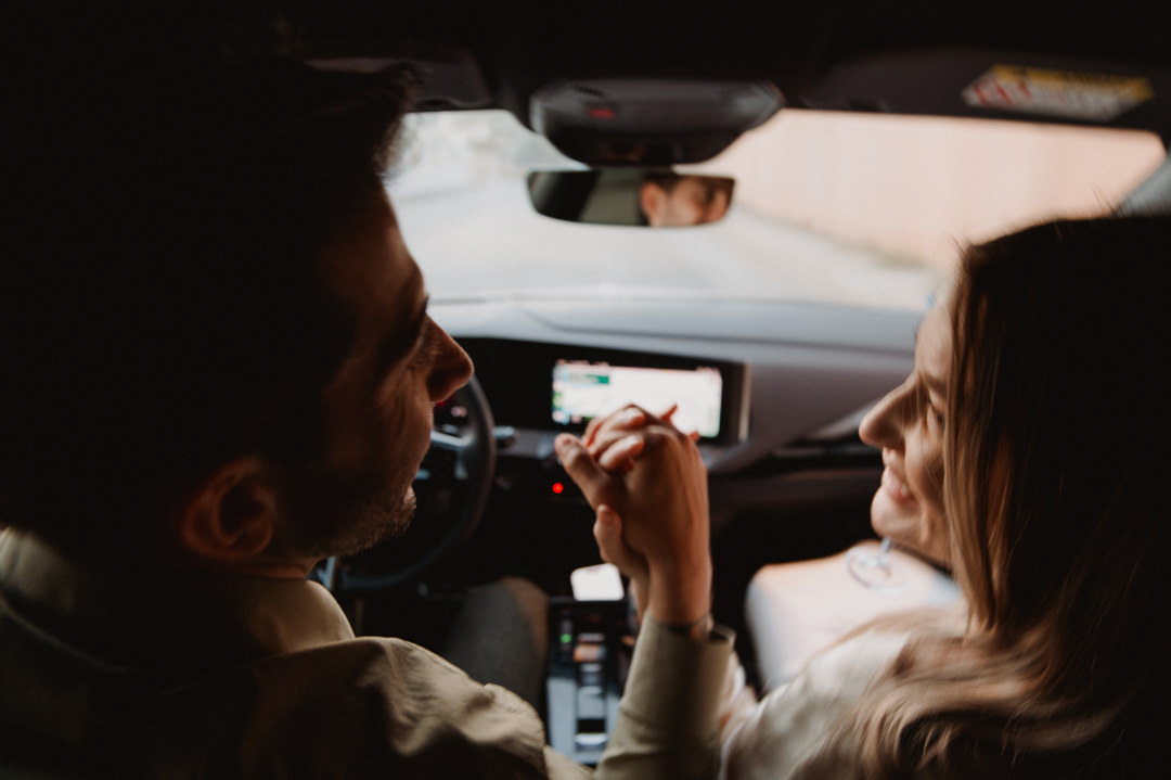 marimurtra elopement - couple holding hands in the car 