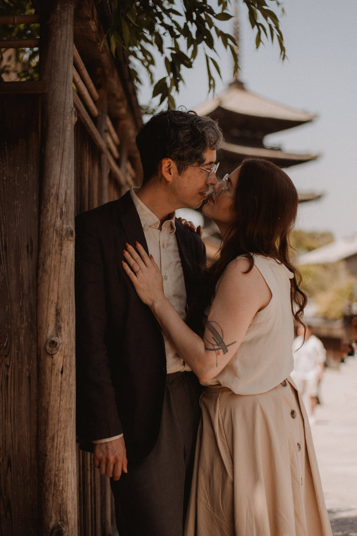 low-key elopement in japan - kissing in front of the pagoda
