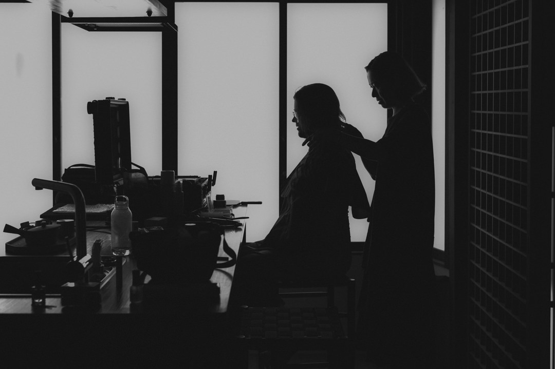 low-key elopement in japan - bride is getting her hair done