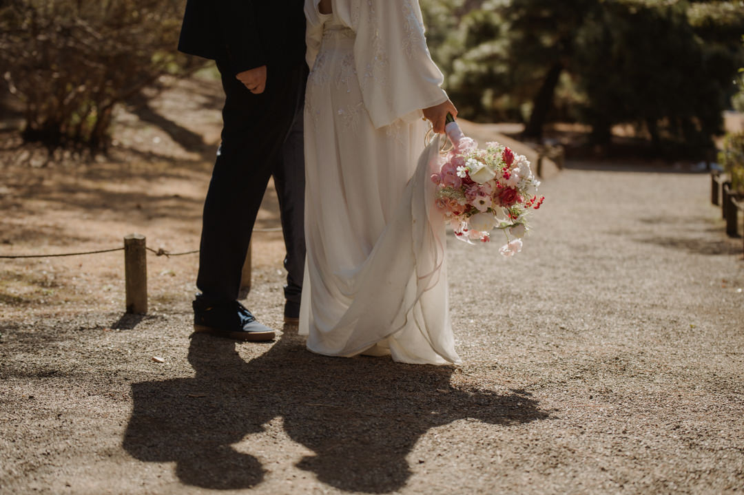 tokyo park elopement - bride is holding her bouquet