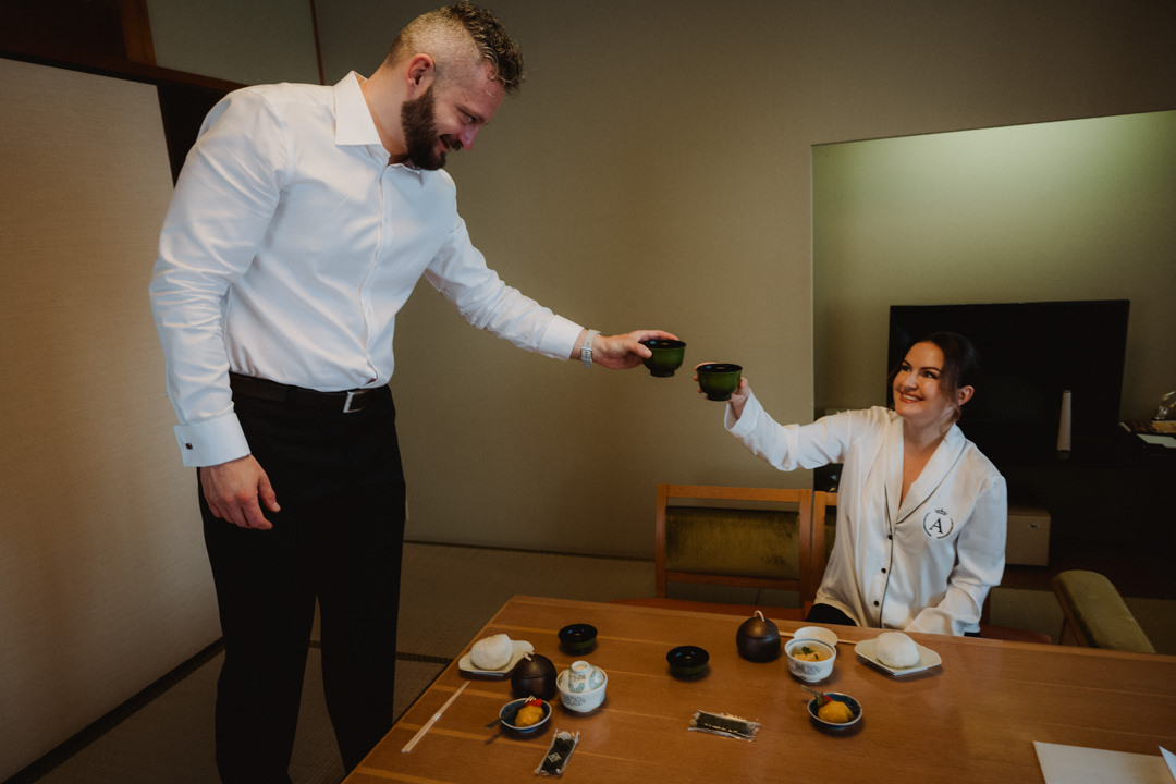Arūnas Valinskas & Aira Ragauskaitė cheering with green tea in their hotel room in Japan