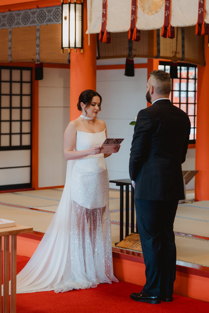 The couple exchanges their vows at a Shinto wedding ceremony.
Cherry blossom Elopement in Wakayama.