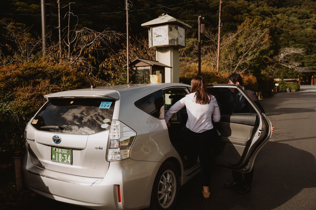 The couple drives back to their hotel by taxi, a same sex elopement in Japan.